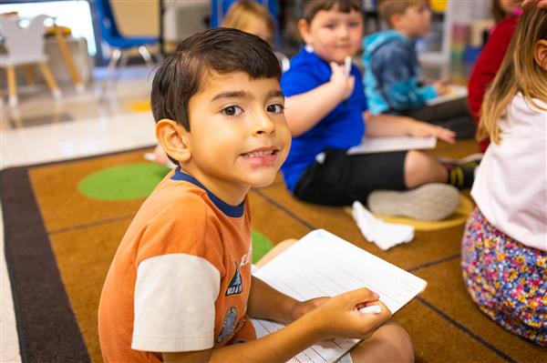 Students inside their classrooms learning. 